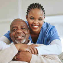 caregiver and senior smiling