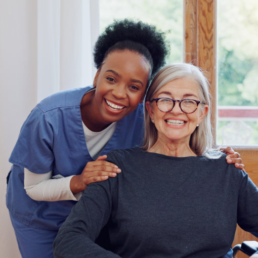 caregiver and senior smiling