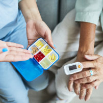 medication pills and heartrate monitor