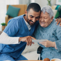 caregiver and senior smiling