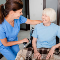 caregiver and senior smiling