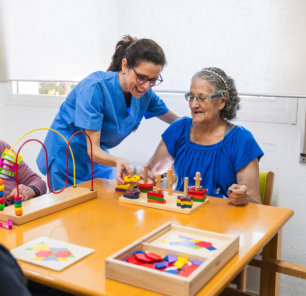 caregiver assisting elderly woman