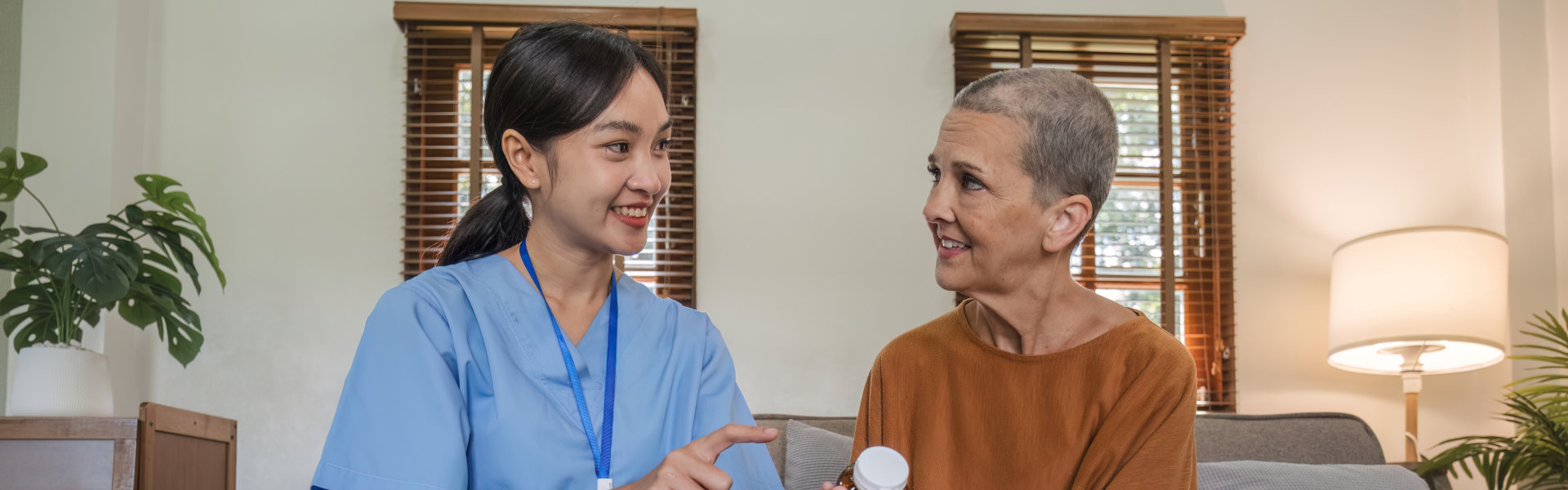 caregiver reminding senior of medication