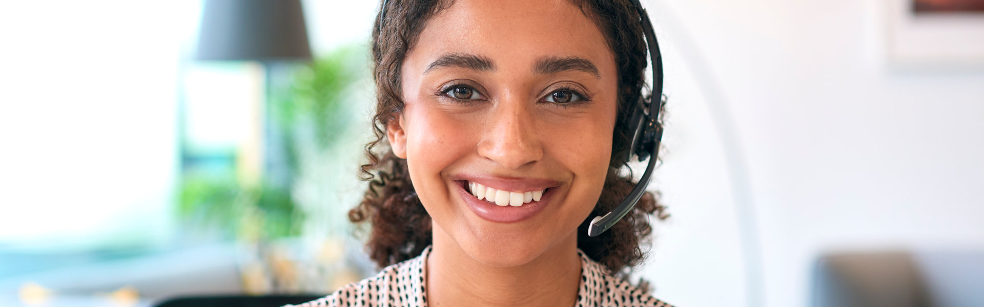 woman with headset smiling