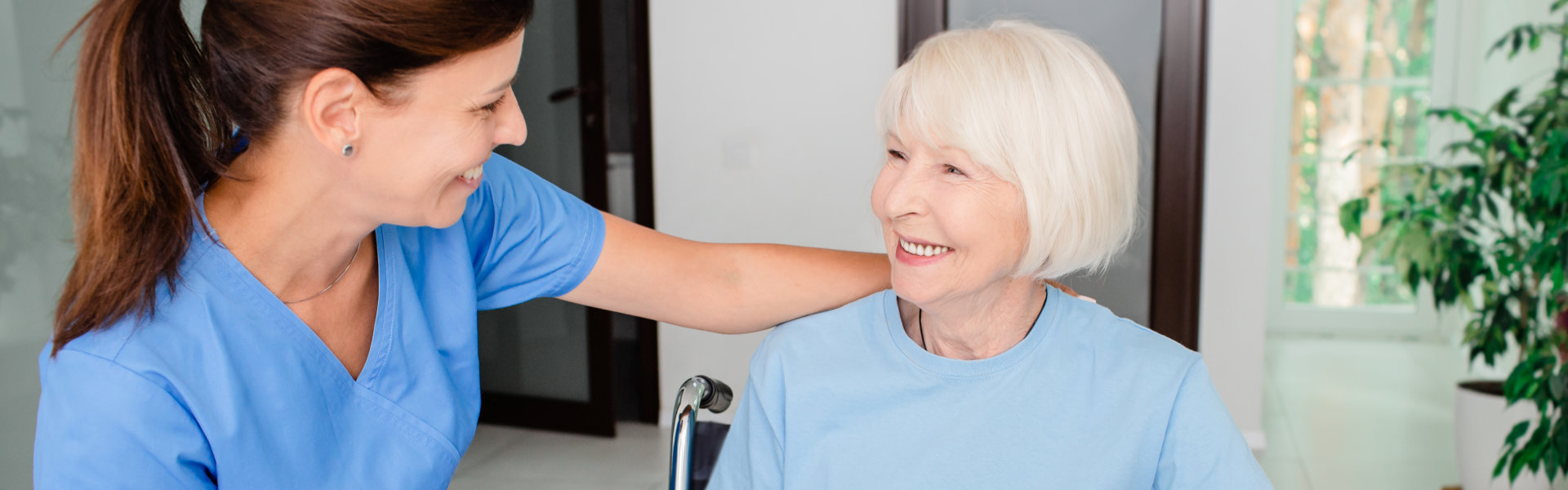 caregiver and senior smiling