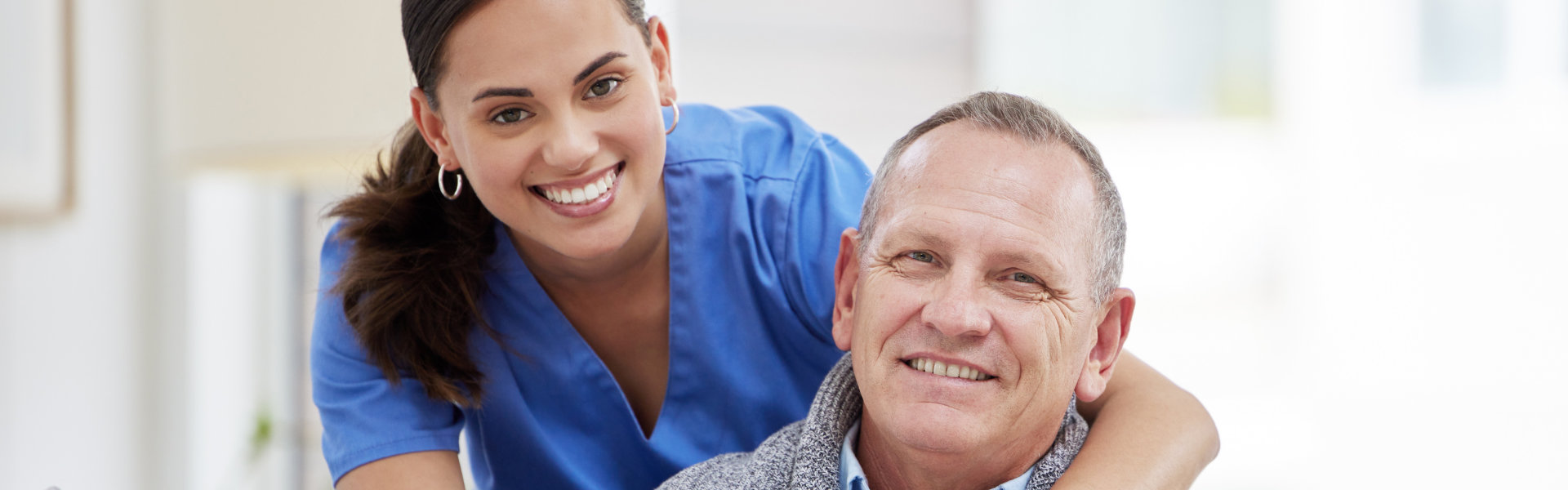 caregiver and senior smiling