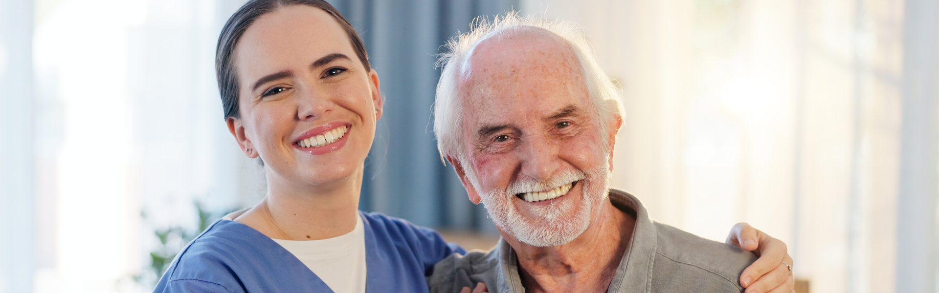caregiver and senior smiling