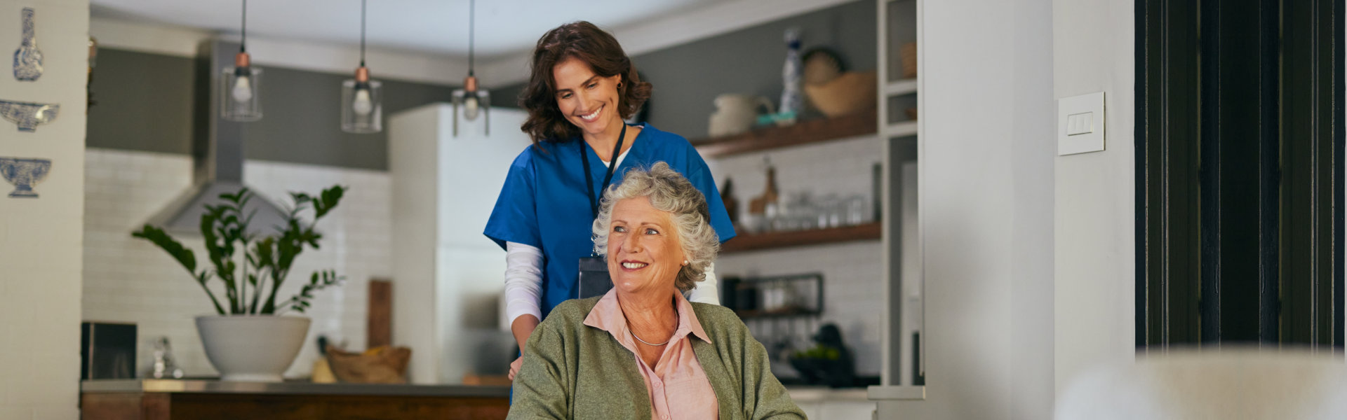 caregiver assisting an elderly