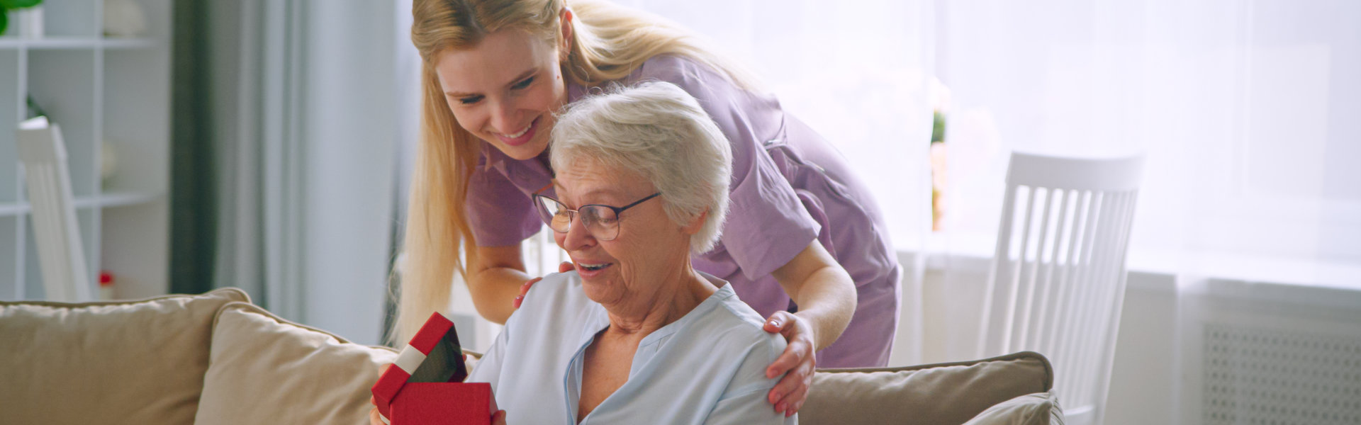 caregiver staff assisted elderly woman